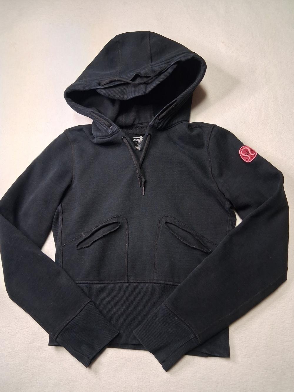 lululemon athletica black hoodie with pink logo patch